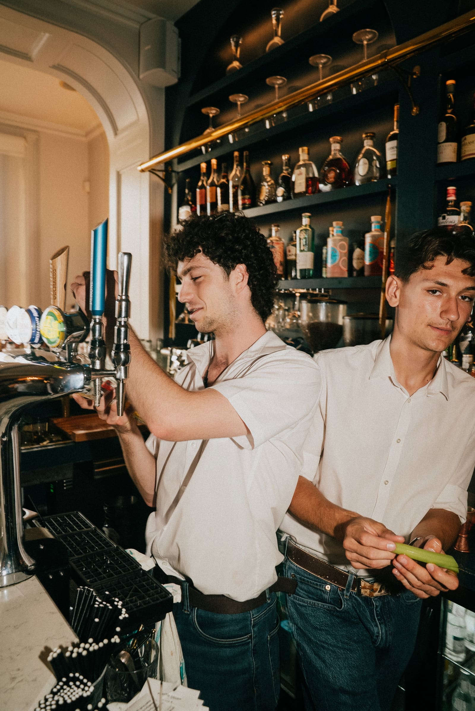 Two of the bar team behind the RT Café Grill bar, one at the taps