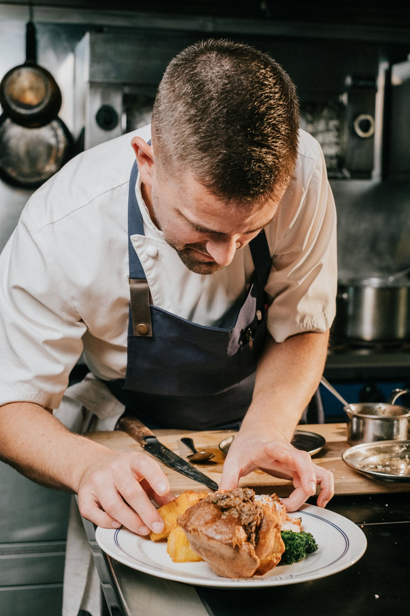 Robert plating a Sunday roast at the pass